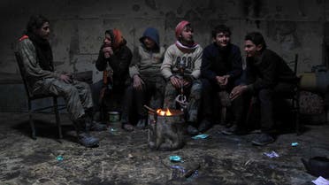 Rebel fighters rest inside a room at the old city of Aleppo near the frontline against forces loyal to Syria's President Bashar al-Assad December 28, 2014.