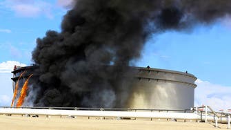 Libyan oil output shrinks more as oil tanks blaze