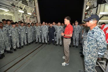 Second Minister for Defence Chan Chun Sing speaking with Republic of Singapore Navy (RSN) servicemen on board RSS Supreme before departing for Indonesia to take part in the search operation. (AFP)