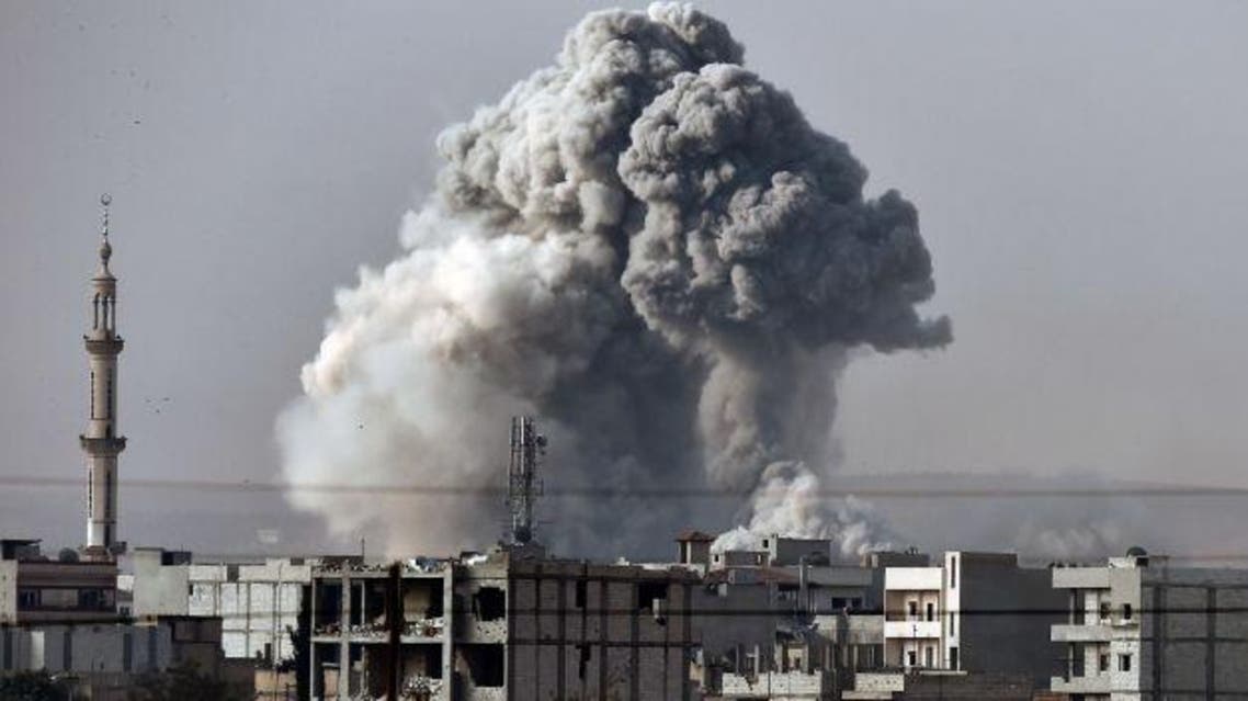 Smoke rises from Kobani after a strike from the U.S.-led coalition, as seen from the Turkish-Syrian border, October 14, 2014. Photo by AFP