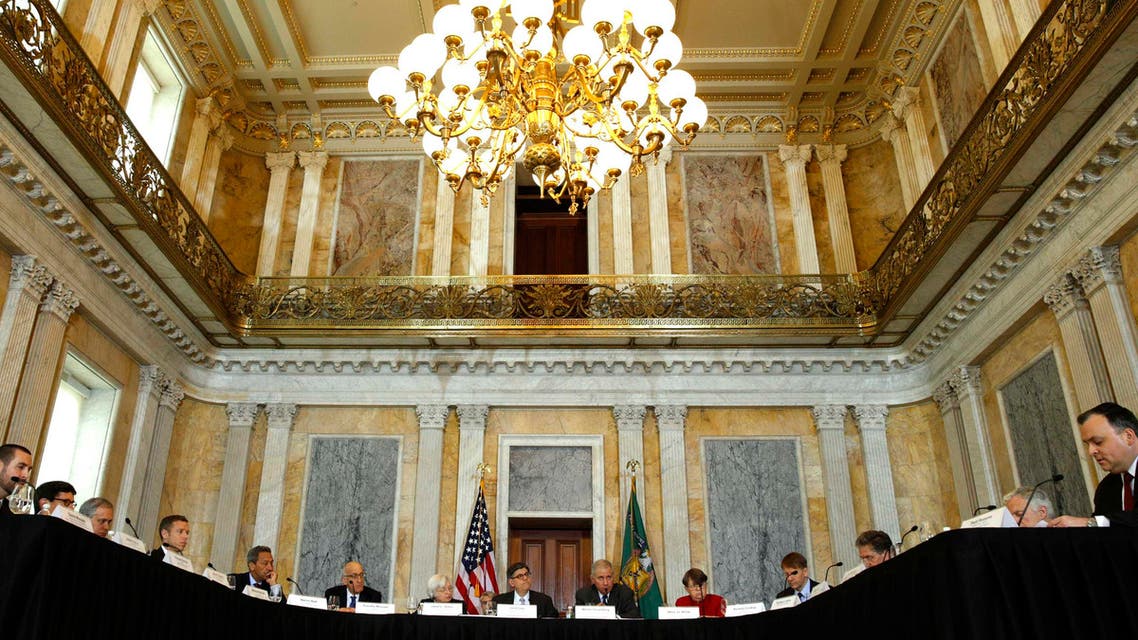 Treasury Secretary Jack Lew (C) hosts an open session meeting of the Financial Stability Oversight Council in the Cash Room of the Treasury in Washington Dec. 18, 2014. (Reuters)