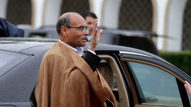 Tunisia's outgoing interim President Moncef Marzouki waves as he leaves the Carthage Palace in Tunis December 31, 2014. REUTERS