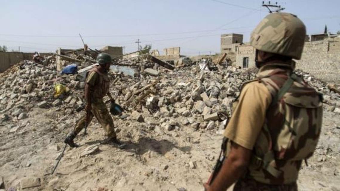 Pakistani soldiers stand near the debris of a house which was destroyed during a military operation against Taliban militants in the town of Miranshah in North Waziristan July 9, 2014. (File Photo: Reuters)