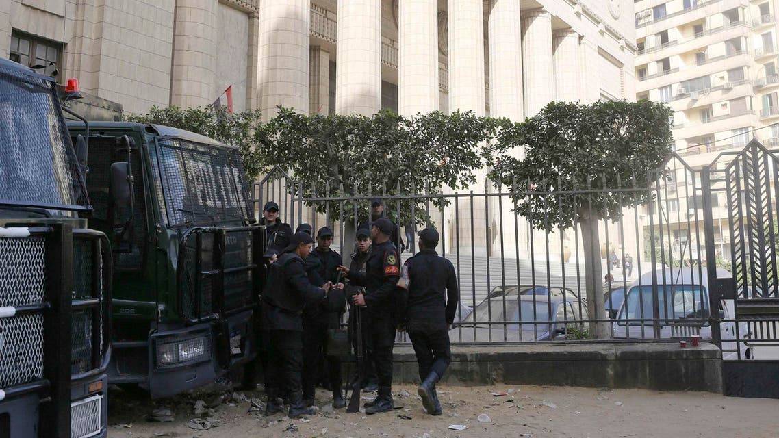Riot police stand guard in front of an appeals court in Cairo January 1, 2015. Egypt's highest court cancelled jail sentences against three journalists working for Al Jazeera television on Thursday and ordered a retrial, a defence lawyer said, in a case that has provoked an international outcry. (Reuters)