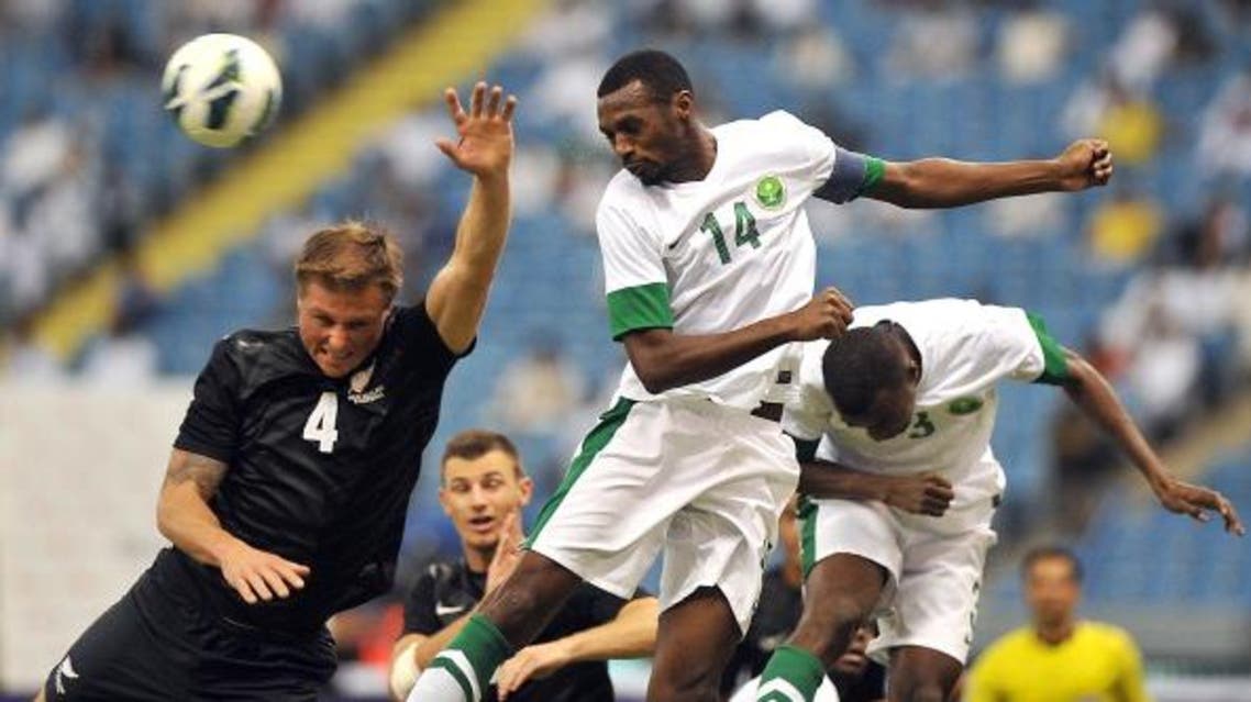 Saudi Arabia's player Saud Kariri defends against New Zealand's national team player Ben Sigmund (L) during their international friendly football match at the King Fahad stadium in 2013. (File photo: AFP)