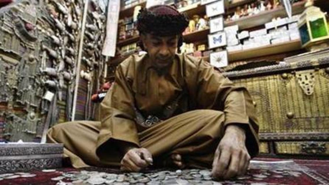 An Omani man sits in his antiques shop in Mattrah Souq, the oldest market in Oman, in the capital Muscat. (File photo Reuters)