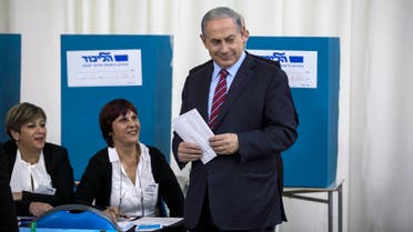 Israel's Prime Minister Benjamin Netanyahu (R) casts his ballot for the Likud primary at a polling station in Jerusalem December 31, 2014. (Reuters)