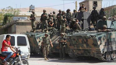 Lebanese Army soldiers are seen on armoured carriers after being deployed inside the Sunni Muslim border town of Arsal, in eastern Bekaa Valley August 9, 2014. (Reuters)