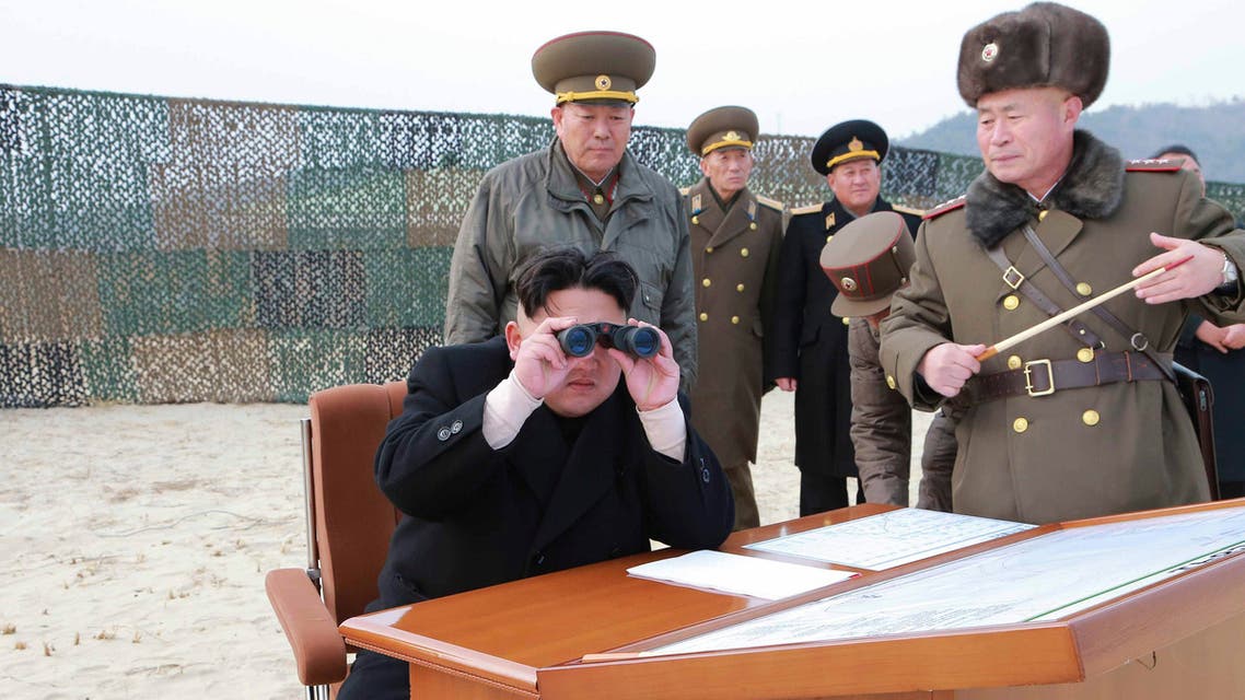 North Korean leader Kim Jong Un looks through a pair of binoculars as he guides the multiple-rocket launching drill of women's sub-units under KPA Unit 851, in this undated photo released by North Korea's Korean Central News Agency (KCNA) in Pyongyang December 30, 2014. (Reuters)
