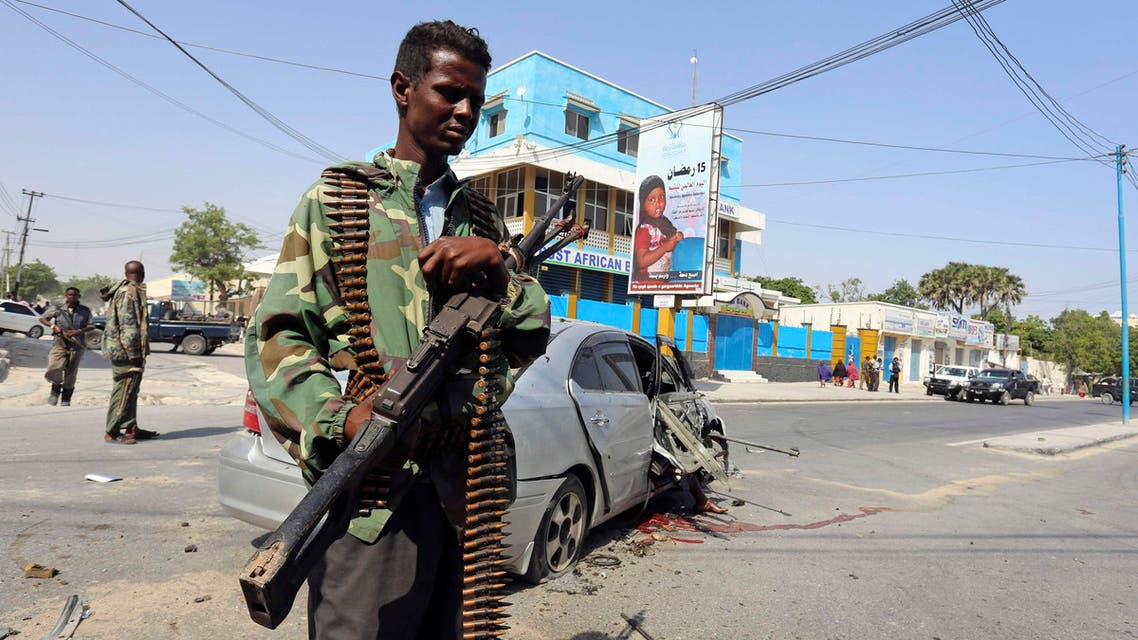 A policeman secures the scene of a car bomb explosion near the Taleex junction of Somalia's capital Mogadishu, January 2, 2015. (Reuters)