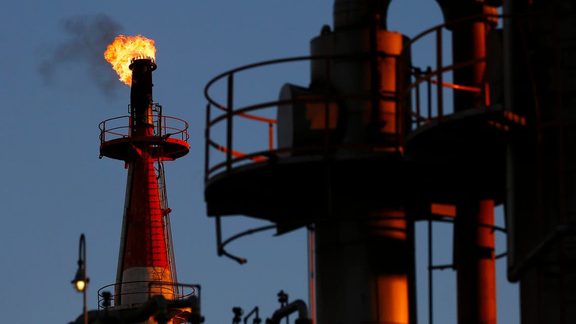 A flame shoots out of a chimney at a petro-industrial factory in Kawasaki near Tokyo Dec. 18, 2014. (Reuters)