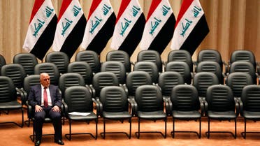 Iraq's new premier Haider al-Abadi sits during a parliamentary session to vote on Iraq's new government at the parliament headquarters in Baghdad in this September 8, 2014 file photo. reuters