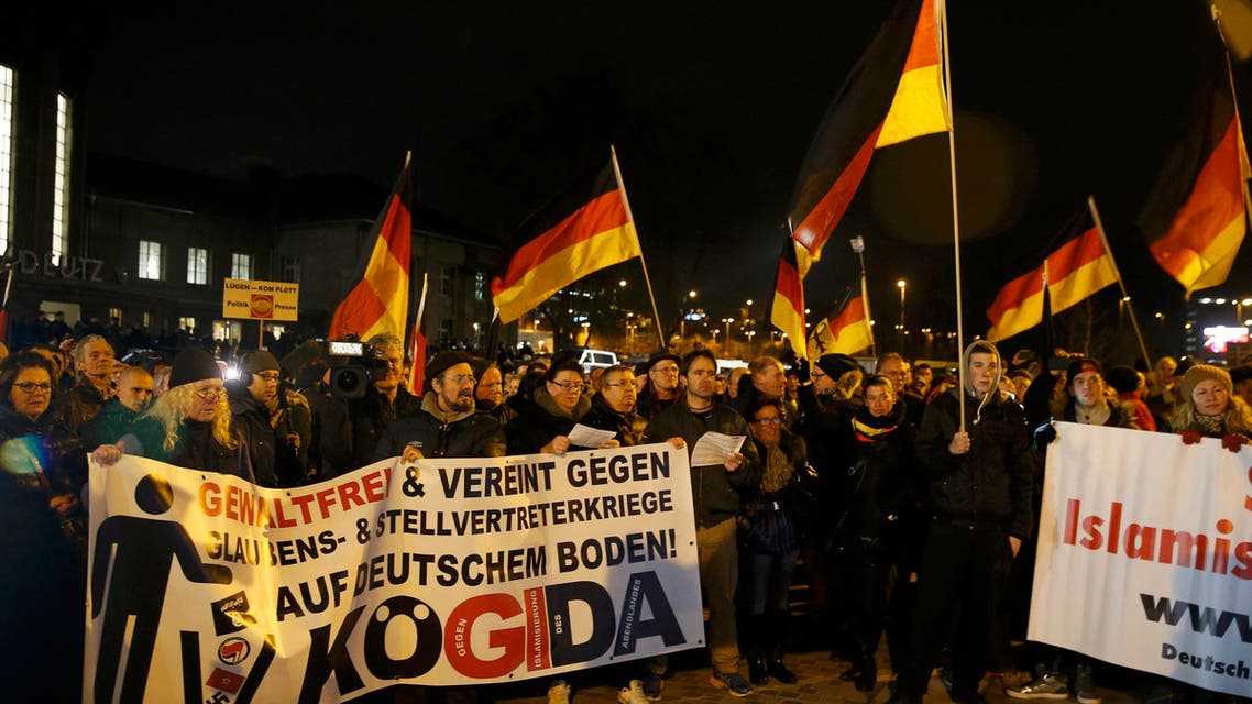 People take part in a march of a grass-roots anti-Muslim movement in Cologne January 5, 2015. Reuters