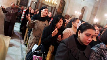 Coptic Orthodox Christian pray during a religious session by father Makary at St Mark Cathedral in Cairo December 26, 2014. Reuters