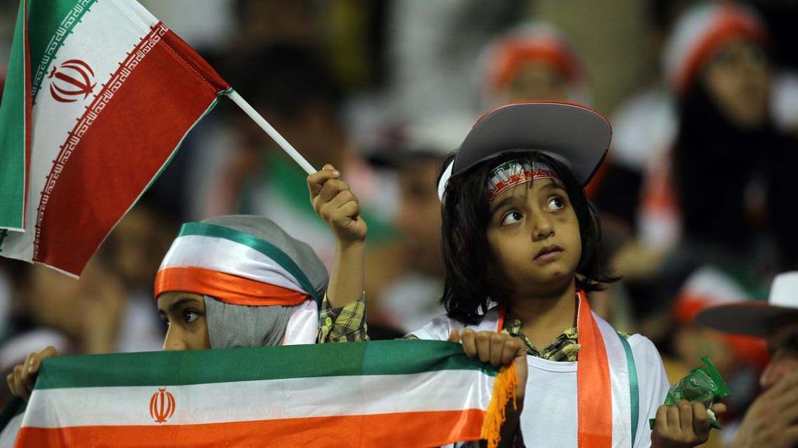 Iranian women fans celebrate their team's win during their 2014 World Cup Asian zone qualifying football match between Qatar and Iran at the Al-Sadd stadium in Doha on Tuesday, June, 4, 2013. (File photo: AP)
