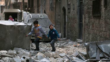 Children make their way through the rubble of buildings in a devastated street on January 1, 2015 in the al-Kalasa neighbourhood of the northern Syrian city of Aleppo. ( File photo: AFP)