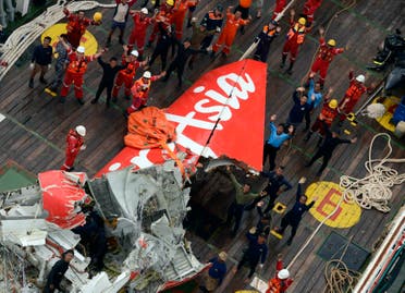 The tail of AirAsia QZ8501 passenger plane is seen on the deck of the Indonesian Search and Rescue (BASARNAS) ship Crest Onyx after it was lifted from the sea bed, Central Kalimantan January 10, 2015. (Reuters)