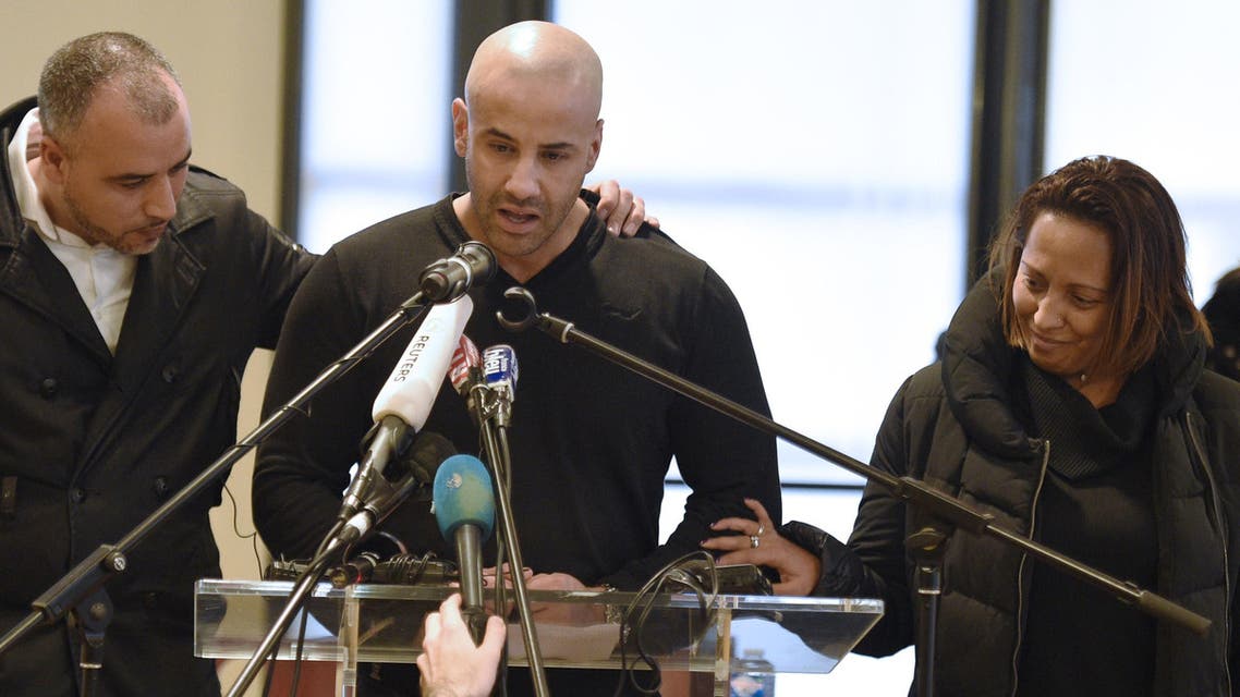 Malek Merabet (C), the brother of slain policeman Ahmed Merabet talks during a press conference in Livry-Gargan, northern Paris suburb, on January 10, 2015. (AFP)