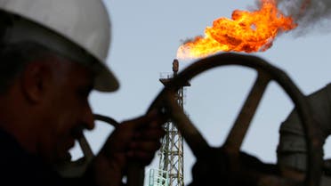 An Iraqi worker opens a pipe at Sheaiba oil refinery in Basra in this March 29, 2007 file photo. (Reuters)