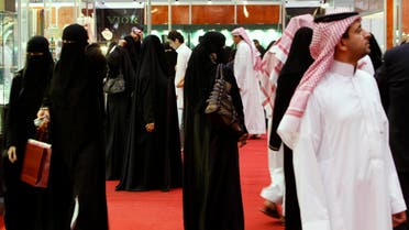 Saudis look at jewelry at a gold fair in Riyadh, Saudi Arabia. (File photo: AP) SAUDIS 