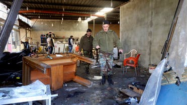 Lebanese Army soldiers walk inside a cafe where a suicide bomb attack took place in Jabal Mohsen, Tripoli January 11, 2015. (Reuters)