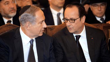 Israeli Prime Minister Benjamin Netanyahu (L) and French President Francois Hollande attend a ceremony at the Grand Synagogue. (Reuters)