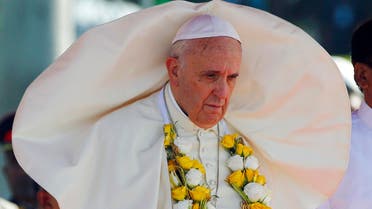 A gust of wind blows the mantle of Pope Francis as he stands next to Sri Lanka's newly elected president Mithripala Sirisena (not seen) at the Colombo airport January 13, 2015. reuters