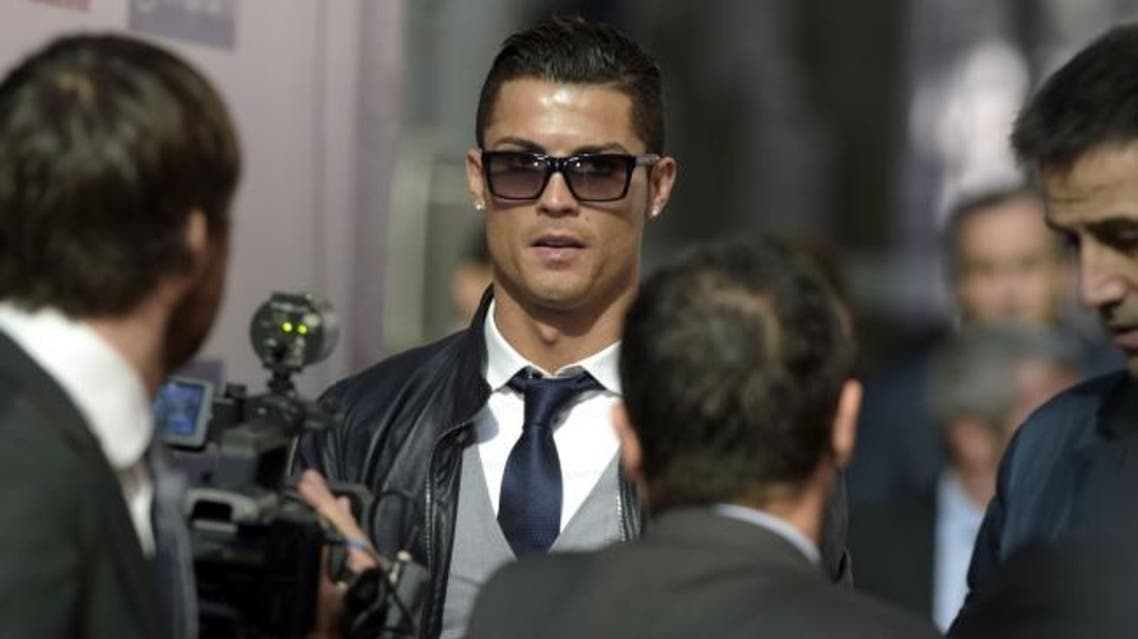 Cristiano Ronaldo arrives to receive the golden boot for La Liga top scorer in Madrid on November 10, 2014. AFP