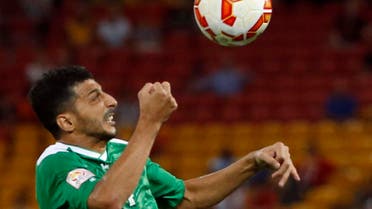 Jordan's Ahmad Hayel (R) looks as he tries to fight for the ball with Iraq's Salam Shakir during their Asian Cup Group D soccer match at the Brisbane Stadium in Brisbane January 12, 2015. (Reuters)
