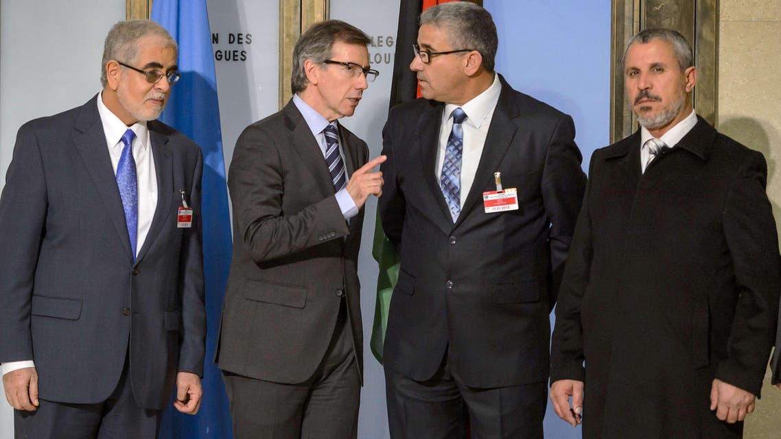 United Nations (UN) special envoy for Libya Bernardino Leon (2nd L) speaks with one the Libya's warring factions representative Fathi Bashagha (2nd R) prior to Libyan talks on January 14, 2015 in Geneva. AFP