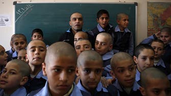 Cancer-stricken Iranian teacher’s pupils shave heads 