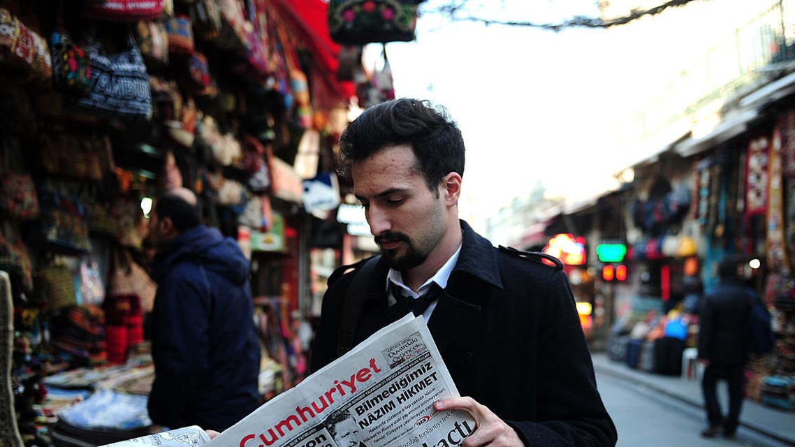 Turkish man reads newspaper AFP