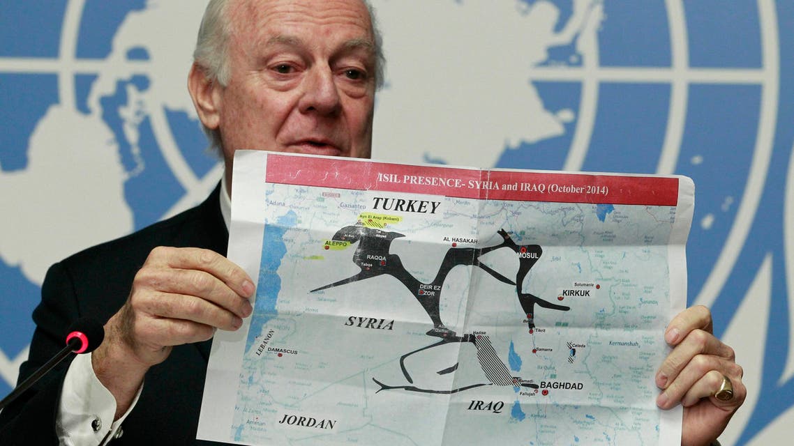Staffan de Mistura holds a map showing ISIL presence in Iraq and Syria during a news conference at the Palais des Nations in Geneva, Jan. 15, 2015. (Reuters)