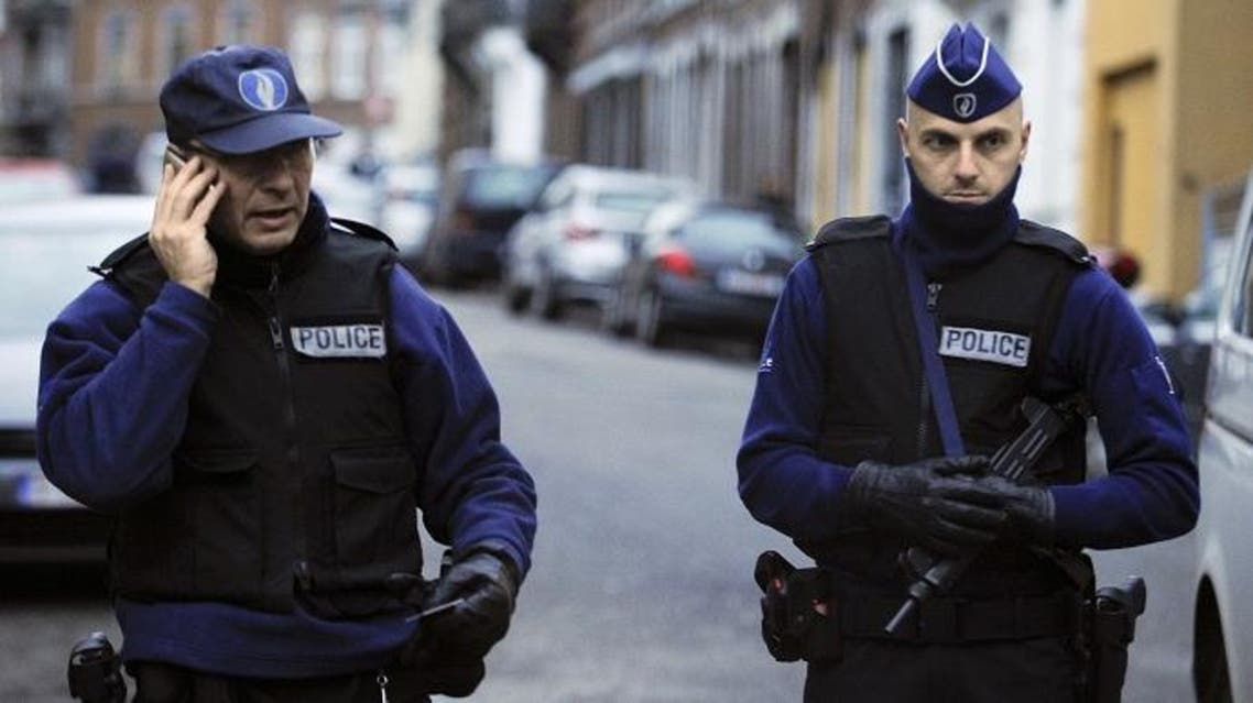 Policemen stand guard at Colline street in Verviers, eastern Belgium, on Jan. 16, 2015. (AFP)