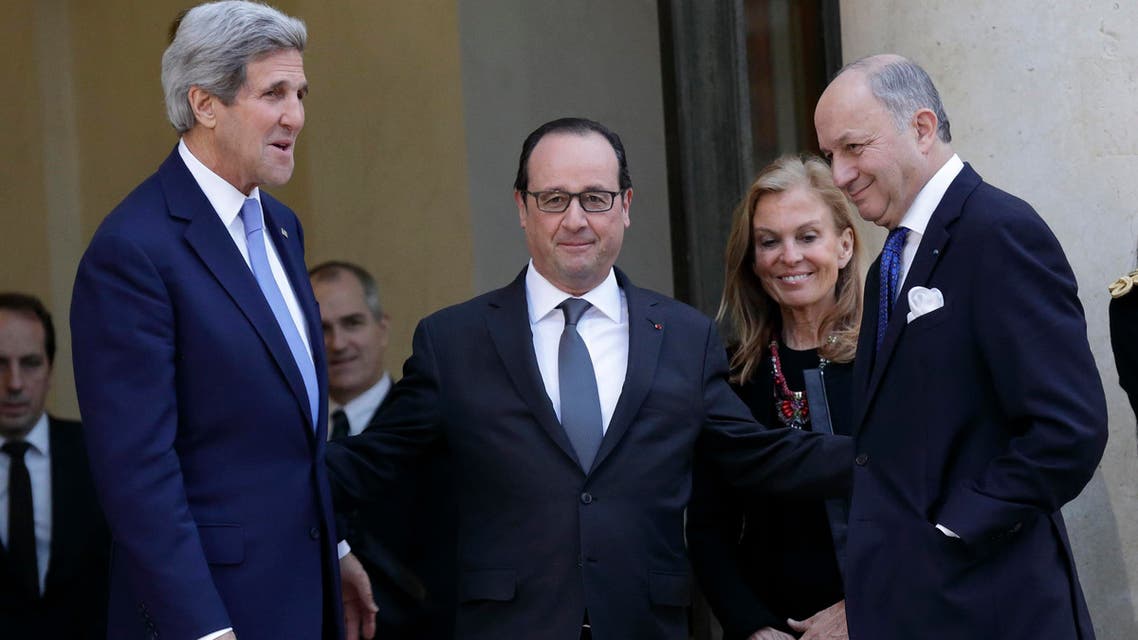 French President Francois Hollande (2ndL) talks with U.S. Secretary of State John Kerry after their meeting attended by US Ambassador to France Jane Hartley (3rdL) and French Foreign Affairs minister Laurent Fabius (R) at the Elysee Palace in Paris Jan. 16, 2015. (Reuters)