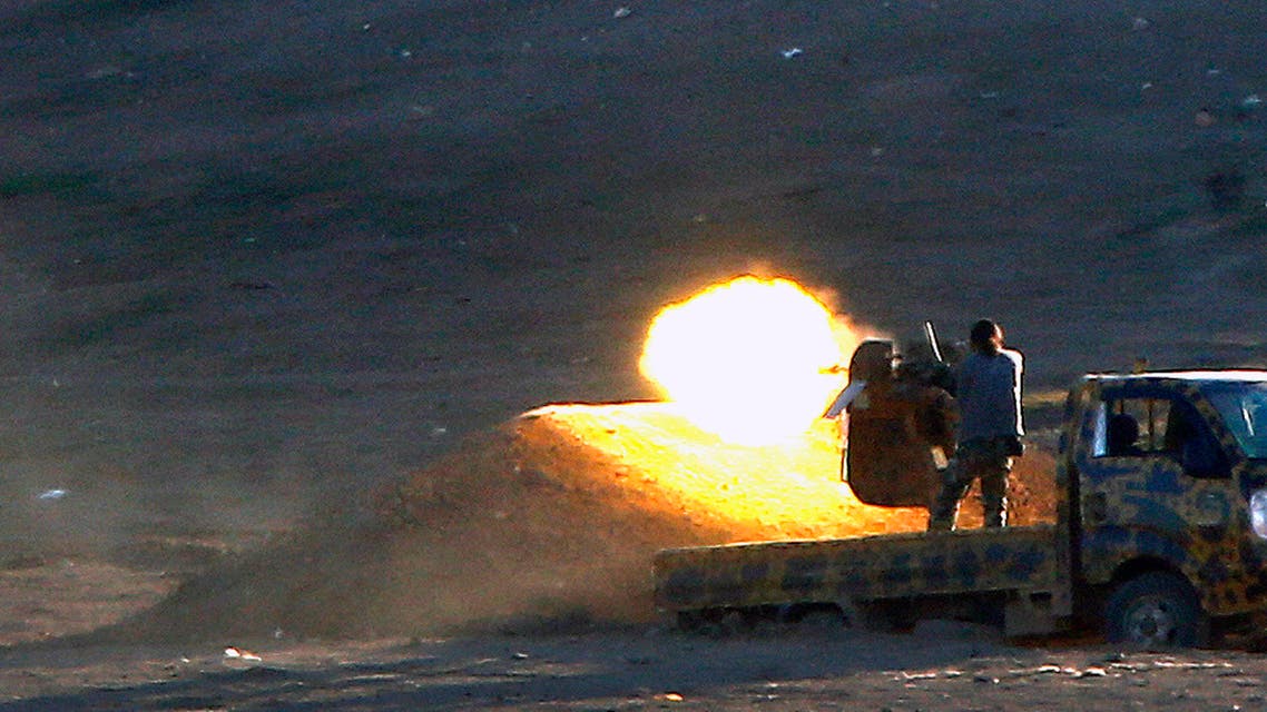 Free Syrian Army fighters fire on ISIS west of Kobani Reuters