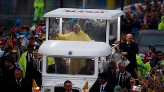 Pope Francis meets millions in Manila with 'jeepney' popemobile 