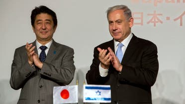 Japan's Prime Minister Shinzo Abe, left, stands with Israeli Prime Minister Benjamin Netanyahu during a conference in Jerusalem, Sunday, Jan. 18, 2015. (Reuters)