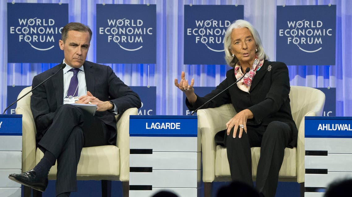 Head of the International Monetary Fund Christine Lagarde, right, gestures as she speaks while Governor of the Bank of England Mark J. Carney, sits next to her during a session at the World Economic Forum in Davos, Switzerland, Saturday, Jan. 25, 2014. (AP Photo)