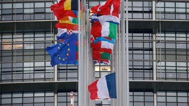 The French and European flags fly at half-mast among flags of the other member states of the European Union in front of the European Parliament in Strasbourg, January 8, 2015. (Reuters)
