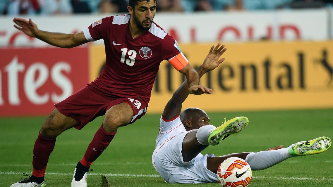 Qatar's Ibrahim Majed (L) fights for the ball with Jaycee John of Bahrain during their Group C football match at the AFC Asian Cup in Sydney on January 19, 2015.