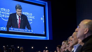 Ukrainian president Petro Poroshenko is seen on a giant screen during a session of the World Economic Forum (WEF) annual meeting on January 21, 2014 in Davos. 