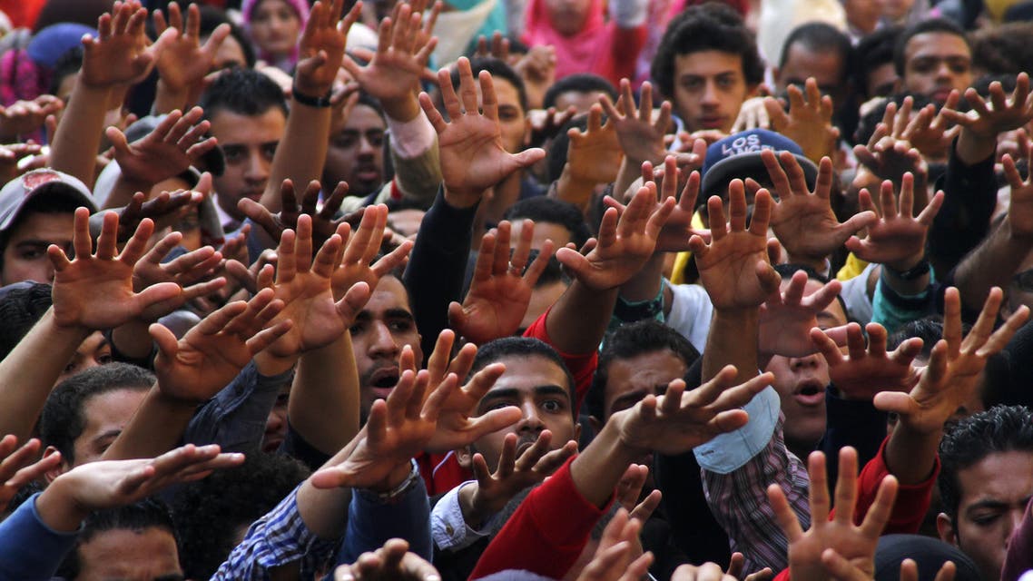 A group of students protest against the dismissal of the murder case against toppled President Hosni Mubarak over the killing of protesters during Egypt’s 2011 uprising, at Cairo University, Cairo, Egypt, Sunday, Nov. 30, 2014. AP