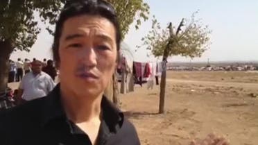Japanese journalist Kenji Goto reports in Kobani in October 2014 in this still image taken from the website www.reportr.co. (AP)