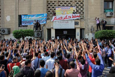 Student protesters hold a rally at Cairo University in Cairo, Egypt, Sunday, Oct. 12, 2014. AP