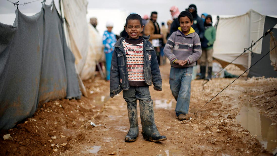 Syrian refugees children play near their family tent at Al Zaatari refugee camp in the Jordanian city of Mafraq, near the border with Syria, January 15, 2015. (Reuters)