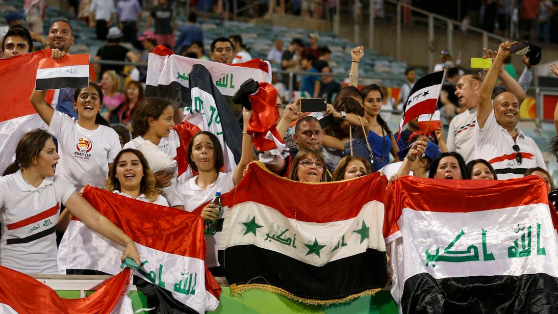 Iraq supporters celebrate their win after the Asian Cup quarter-final soccer match between Iran and Iraq at the Canberra stadium in Canberra January 23, 2015. (Reuters)