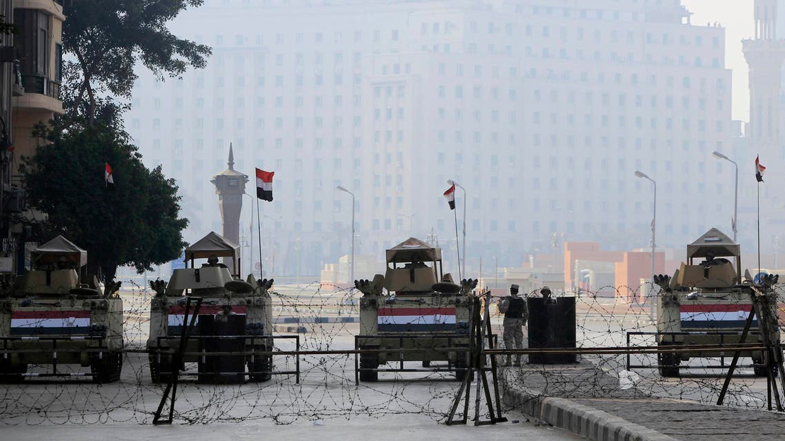 Armoured vehicles and barbed wire block an entrance to Tahrir Square during the 4th anniversary of the January 2011 uprising, in Cairo January 25, 2015. (Reuters)