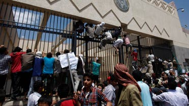 Yemeni protesters climb the gate of the U.S. Embassy during a protest about a film ridiculing Islam's Prophet Muhammad, in Sanaa, Yemen, Thursday, Sept. 13, 2012.  (AP)