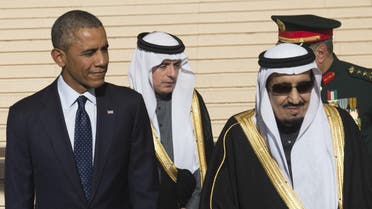 US President Barack Obama stands alongside Saudi new King Salman (R) after arriving on Air Force One at King Khalid International Airport in the capital Riyadh on January 27, 2015. AFP